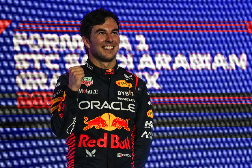 Red Bull driver Sergio Perez of Mexico celebrates after winning the Saudi Arabia Formula One Grand Prix at the Jeddah corniche circuit in Jeddah, Saudi Arabia, Sunday, March 19, 2023. (AP Photo/Hassan ...