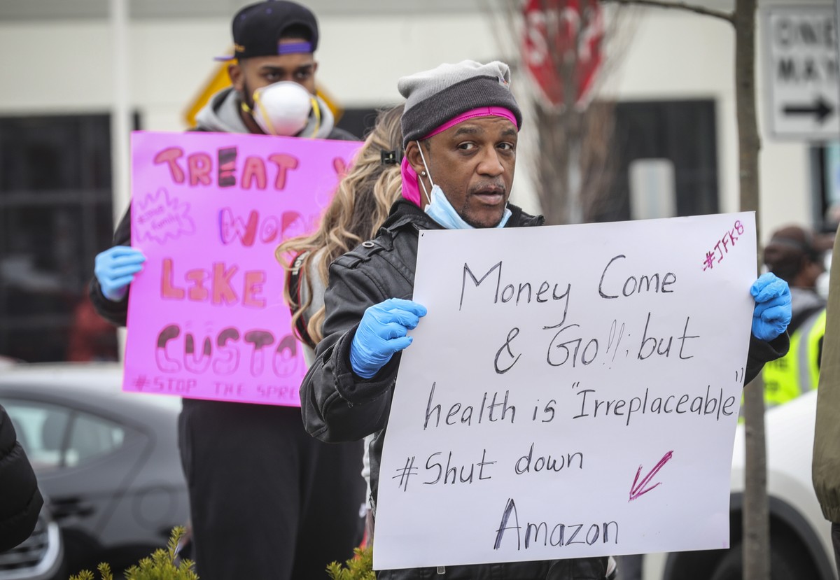 Gerald Bryson, left, join workers at an Amazon fulfillment center in Staten Island, N.Y., protesting conditions in the company's warehouse, Monday March 30, 2020, in New York. Workers say Amazon  ...