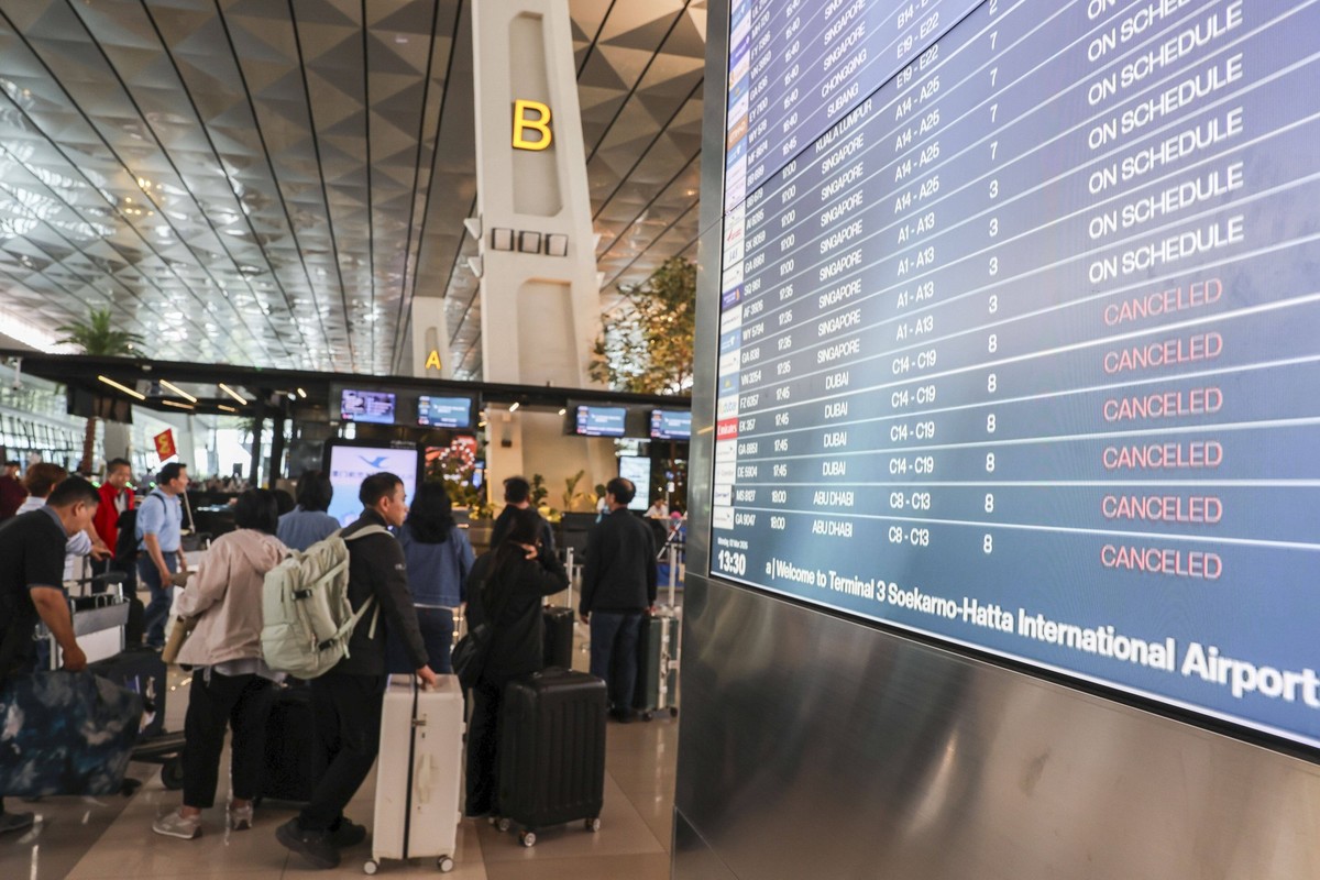 Indonesian Flights To Middle East Canceled After Strikes On Iran Trigger Airspace Closures A departure board displays flight cancellations at Soekarno-Hatta International Airport after several flights ...