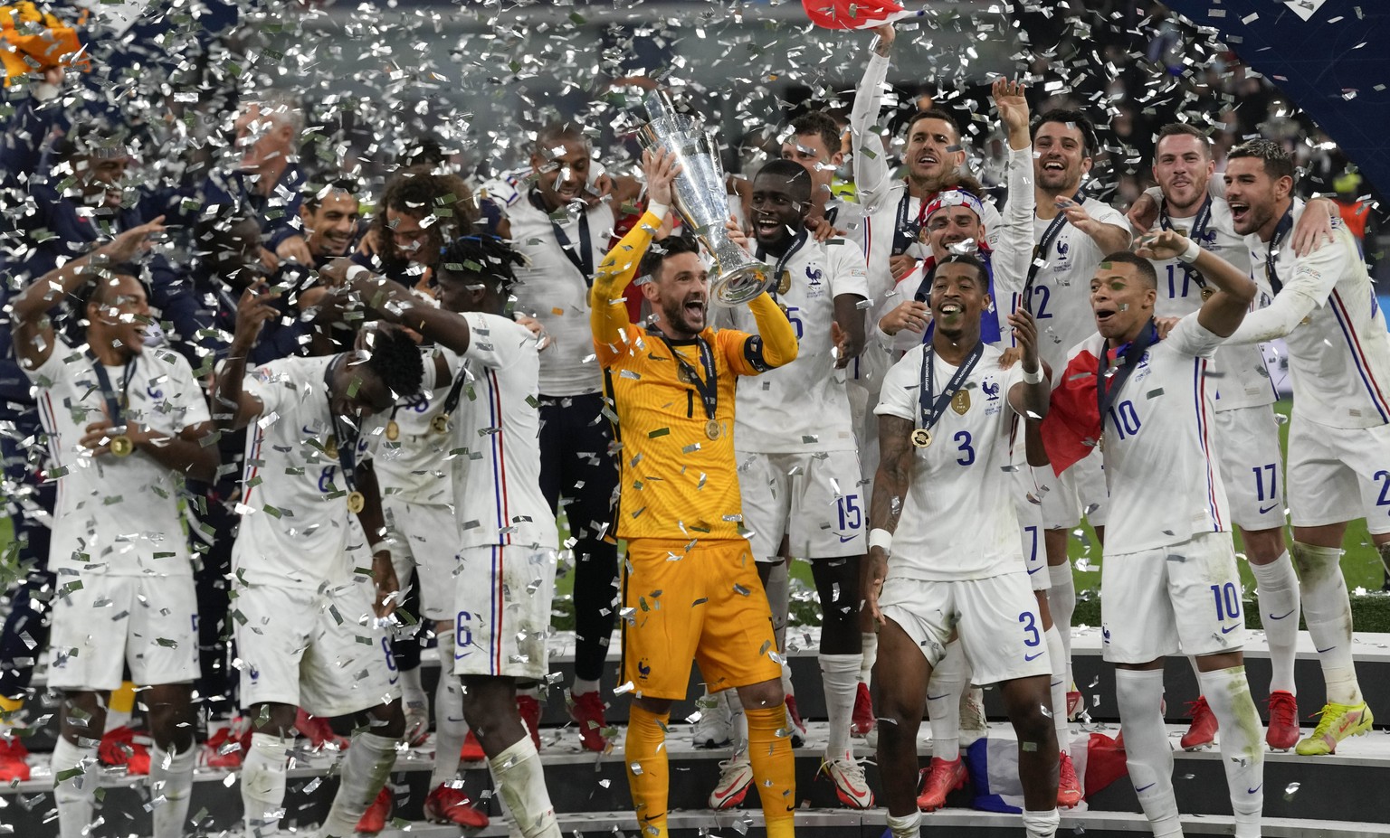 France's players celebrate their victory at the end of the UEFA Nations League final soccer match between France and Spain at the San Siro stadium, in Milan, Italy, Sunday, Oct. 10, 2021. (AP Photo/Lu ...