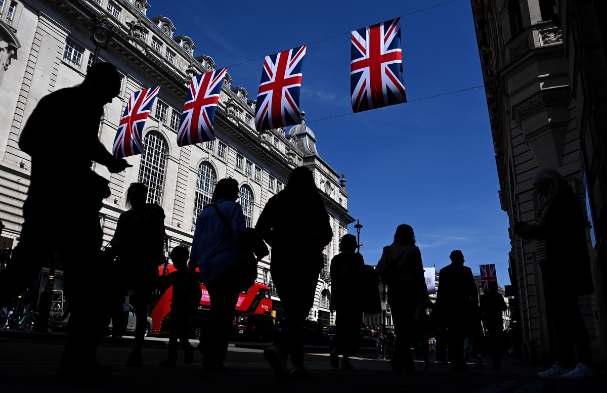 epaselect epa10598333 Union flags are draped across a street in London, Britain, 29 April 2023. Britain's King Charles III's Coronation takes place at Westminster Abbey in London on 06 May 2 ...