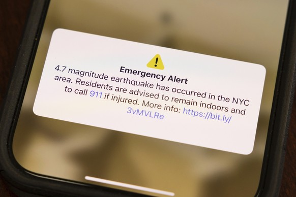 A screen shows an emergency alert in New York City area, Friday, April. 5, 2024, in New York. An earthquake shook the densely populated New York City metropolitan area Friday morning, the U.S. Geologi ...