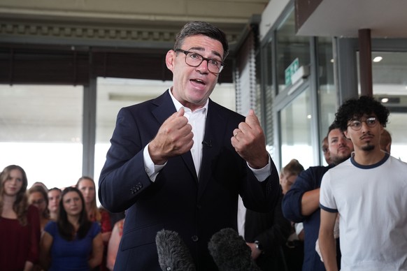 Newly confirmed Labour Party leader Andy Burnham speaks with local stakeholders and party supporters during a visit to Gravesend Town Pier, Gravesend , England, Friday July 17, 2026. (Gareth Fuller/PA ...