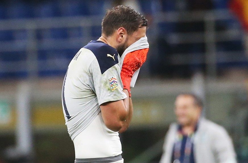 epa09509961 Italian goalkeeper Gianluigi Donnarumma walks off the pitch after Spain won the UEFA Nations League semi final soccer match between Italy and Spain in Milan, Italy, 06 October 2021. EPA/MA ...