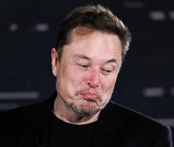 epa10998583 US tech entrepreneur Elon Musk, owner of Tesla, SpaceX and X, reacts as he attends a conversation event with British Prime Minister Rishi Sunak (unseen) in central London, Britain, 02 Nove ...