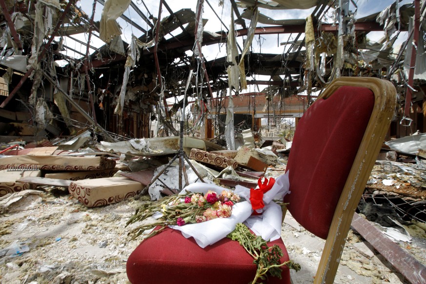 Flowers are seen on a chair during a visit by human rights activists to a community hall that was struck by an air strike during a funeral on October 8, in Sanaa, Yemen, October 16, 2016. REUTERS/Moha ...