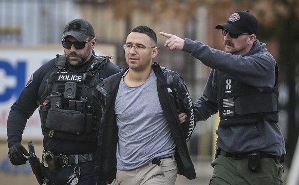 FILE - Solomon Pena, center, a Republican candidate for New Mexico House District 14, is taken into custody by Albuquerque Police officers, Jan. 16, 2023, in southwest Albuquerque, N.M. Two years sinc ...