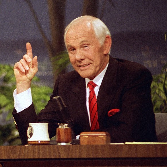 FILE - In this May 22, 1992 file photo, host Johnny Carson gestures on "The Tonight Show" during his broadcast in Burbank, Calif. said Thursday that it is developing a miniseries based on th ...