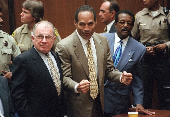 In this Oct. 3, 1995 file photo, O.J. Simpson reacts as he is found not guilty of murdering his ex-wife Nicole Brown Simpson and her friend Ron Goldman, at the Criminal Courts Building in Los Angeles. ...