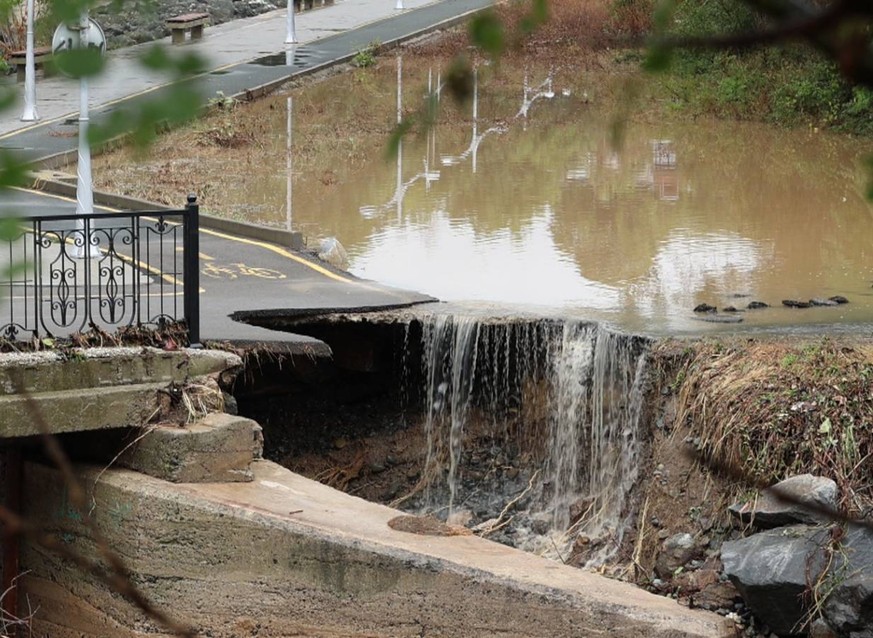 epa10844014 A closed road deteriorated by heavy flooding in Tsarevo, Bulgaria, 06 September 2023. Thunderstorms, heavy downpours and flash flooding caused a river overflow leading to three fatalities, ...