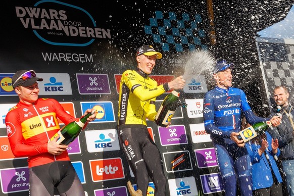 epa11247050 US rider Matteo Jorgenson of Team Visma Lease A Bike (C) celebrates on the podium with second placed Norway&#039;s Jonas Abrahamsen (L) of Uno-X Mobility and third placed Swiss rider Stefa ...