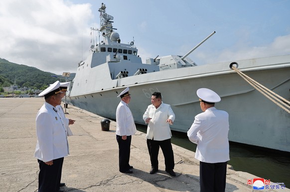 epa10811192 An undated photo released by the official North Korean Central News Agency (KCNA) on 21 August 2023 shows North Korean leader Kim Jong Un (2-R) inspecting a flotilla of the East Sea Fleet  ...