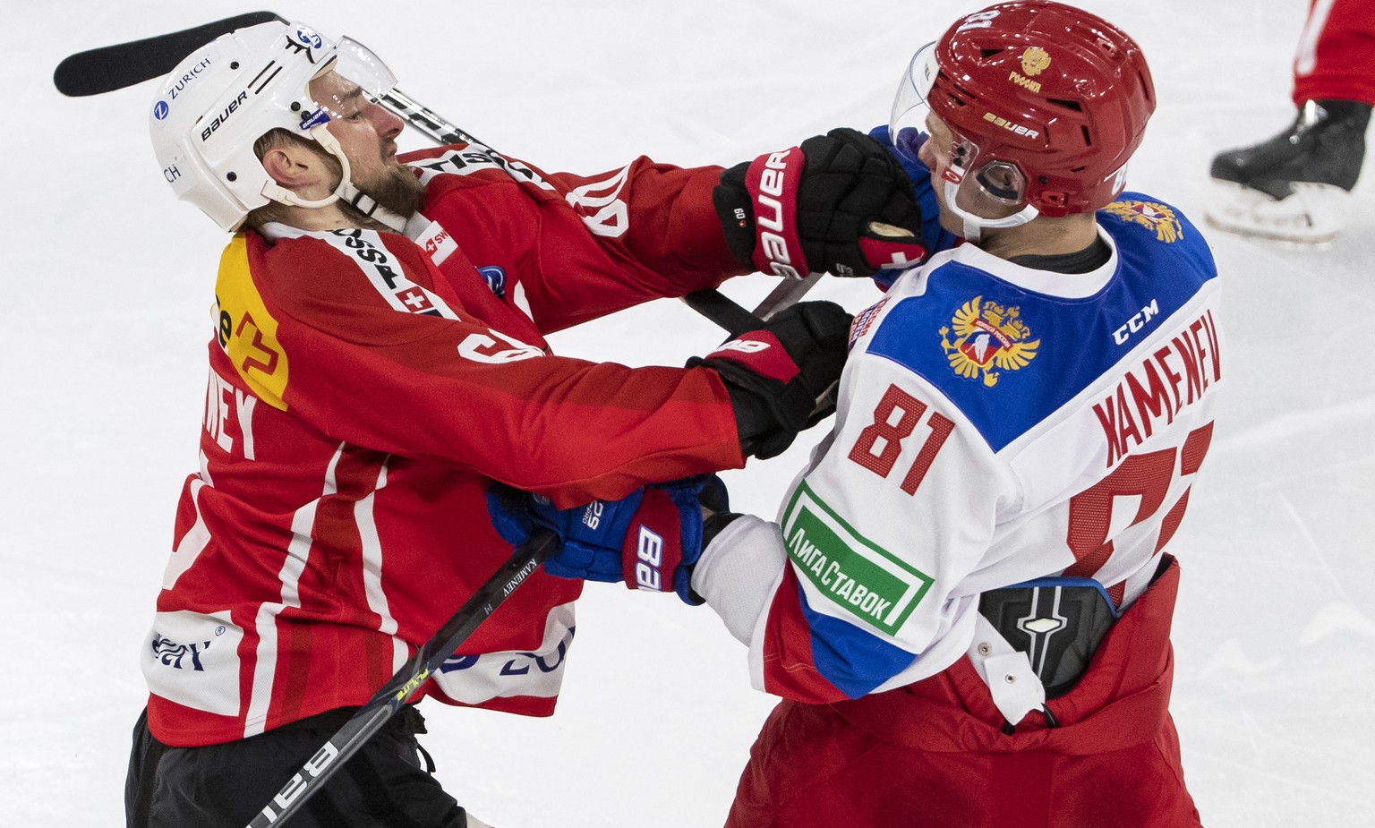 Switzerland&#039;s Tristan Scherwey, left, fights against Russia&#039;s Vladislav Kamenev during a friendly ice hockey match between Switzerland and Russia, at the Tissot Arena in Biel, Switzerland, S ...