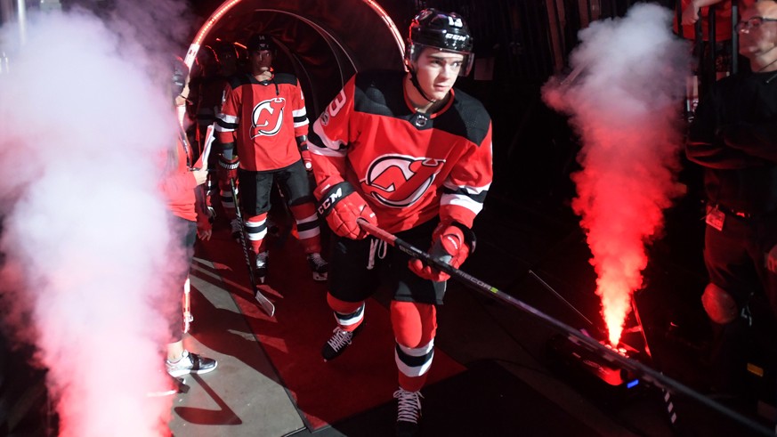 New Jersey Devils center Nico Hischier comes onto the ice before an NHL hockey game against the Colorado Avalanche Saturday, Oct. 7, 2017, in Newark, N.J. (AP Photo/Bill Kostroun)