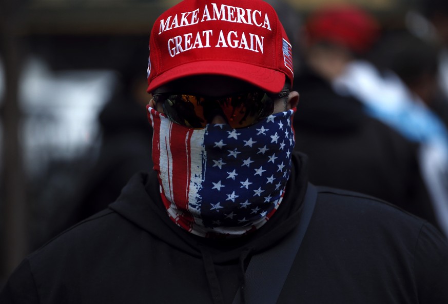 epaselect epa10534370 A Trump supporter attends a rally held by the New York Young Republicans outside of New York Criminal Court at a rally for Former President Donald Trump in New York, New York, US ...