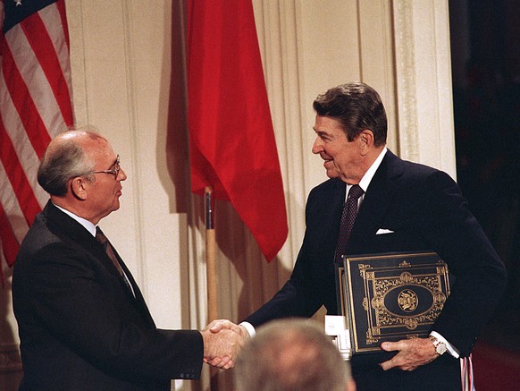 FILE - Int this Dec. 8, 1987, file photo, U.S. President Ronald Reagan, right, shakes hands with Soviet leader Mikhail Gorbachev after the two leaders signed the Intermediate Range Nuclear Forces Trea ...
