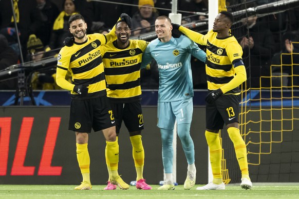 YB's Loris Benneteau, Ulises Garciam goalkeeper Anthony Racioppi and Mohamed Ali Kamara, from left to right, celebrate after a 2-0 win during the Champions League Group G match between Switzerland...