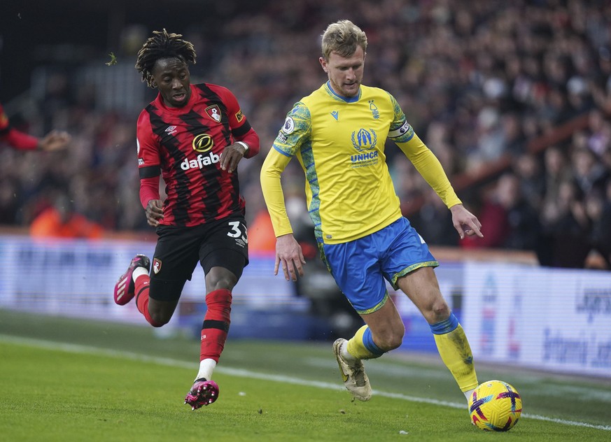 Bournemouth&#039;s Jordan Zemura and Nottingham Forest&#039;s Joe Worrall, right, battle for the ball during the Premier League match between AFC Bournemouth and Nottingham Forest at the Vitality Stad ...