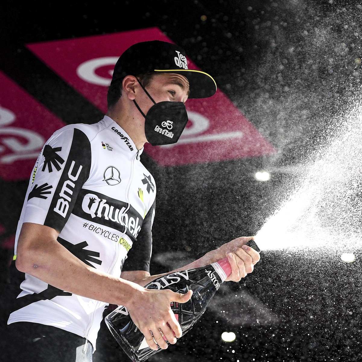 Switzerland's Mauro Schmid celebrates on the podium winning the eleventh stage of the Giro d'Italia cycling race, from Perugia to Montalcino, Italy, Wednesday, May 19, 2021. (Marco Alpozzi/L ...