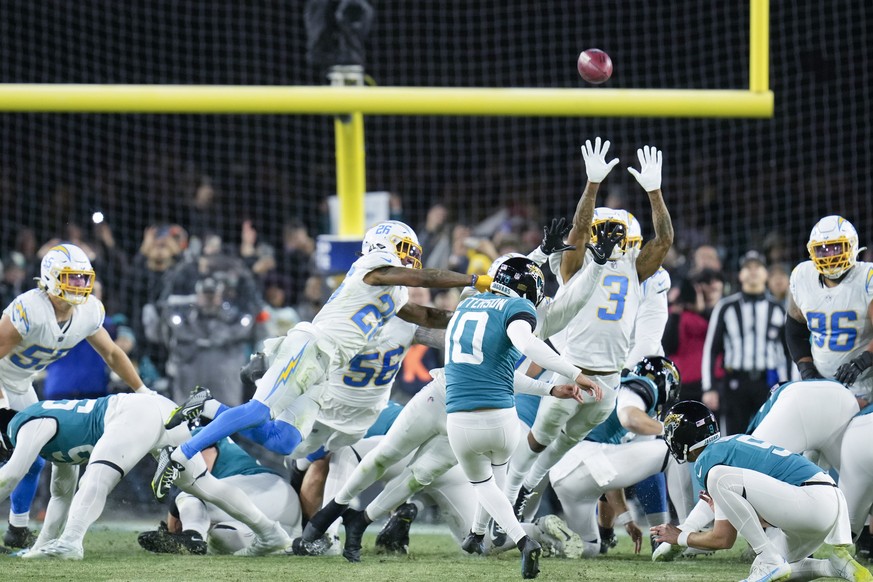 Jacksonville Jaguars place kicker Riley Patterson (10) kicks the game-winning field goal against the Los Angeles Chargers during the second half of an NFL wild-card football game, Saturday, Jan. 14, 2 ...