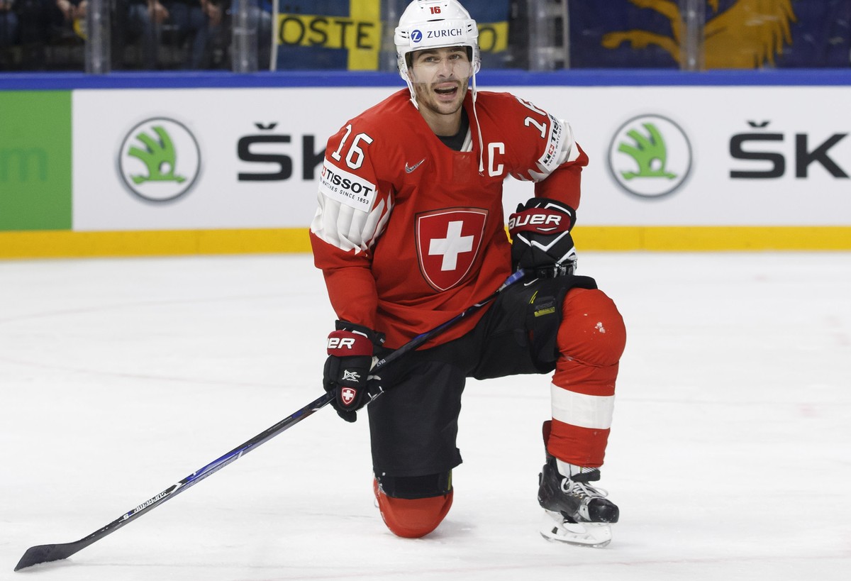 Switzerland's defender Raphael Diaz, right, reacts after taking a penalty past Sweden's forward Mika Zibanejad, left, during the IIHF 2018 World Championship preliminary round game between S ...