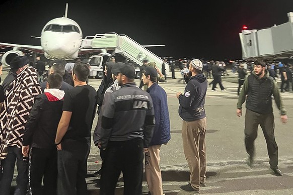 People in the crowd shout anti-Semitic slogans at an airport near the airport in Makhachkala, Russia, on Monday, October 8.  January 30, 2023. Russian news agencies and social media say hundreds of people...