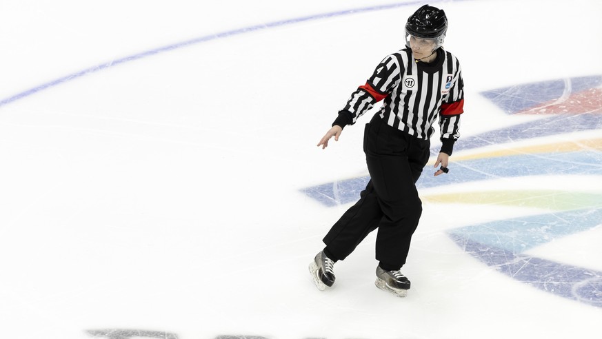 Switzerland&#039;s Head referee Anna Wiegand gestures, during the preliminary round game of the women&#039;s ice hockey game between Canada and Switzerland at the 2022 Winter Olympics in Beijing, Chin ...