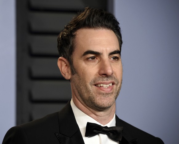 FILE - In this March 4, 2018 file photo, Sacha Baron Cohen arrives at the Vanity Fair Oscar Party in Beverly Hills, Calif. Cohen stars in the new Showtime series &quot;Who Is America?&quot;, premierin ...