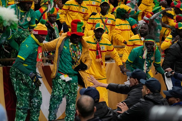 Senegal supporters react after a controversial penalty was awarded to Morocco late on during the Africa Cup of Nations final soccer match between Senegal and Morocco in Rabat, Morocco, Sunday, Jan. 18 ...