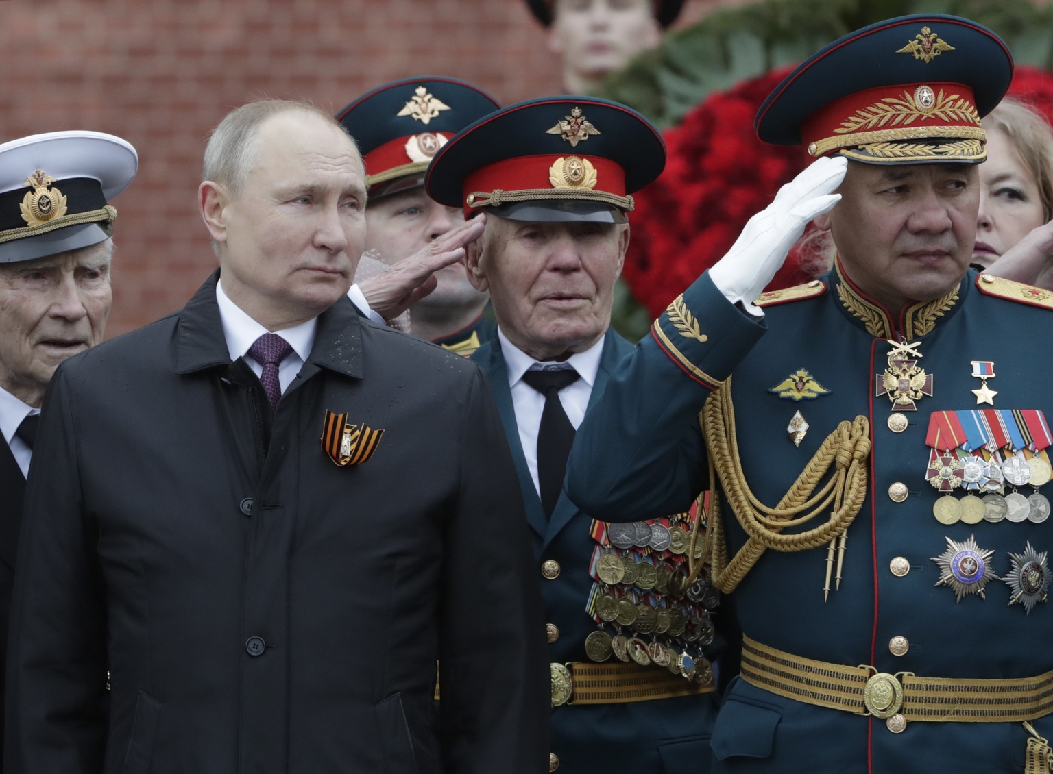 epa09186952 Russian President Vladimir Putin (front L) and Russian Defense Minister Sergei Shoigu (R) attend a wreath laying ceremony at the Tomb of the Unknown Soldier near the Kremlin wall after the ...
