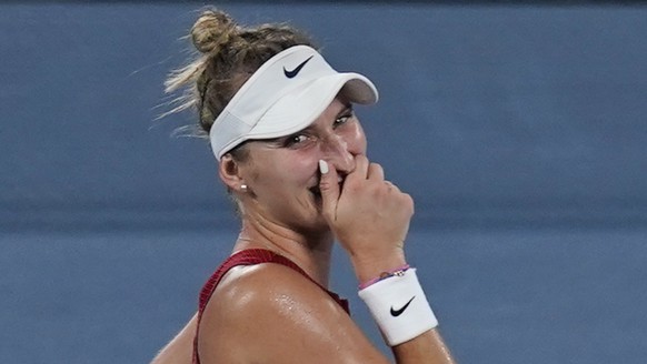 Marketa Vondrousova, of the Czech Republic, celebrates after defeating Elina Svitolina, of the Ukraine, during the semifinals of the tennis competition at the 2020 Summer Olympics, Thursday, July 29,  ...