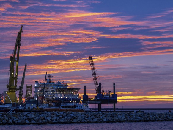 FILE - The Russian pipe-laying ship &#039;Akademik Tscherski&#039; which is on deployment for the further construction of the Nord Stream 2 Baltic Sea pipeline, is moored at the port of Mukran on the  ...