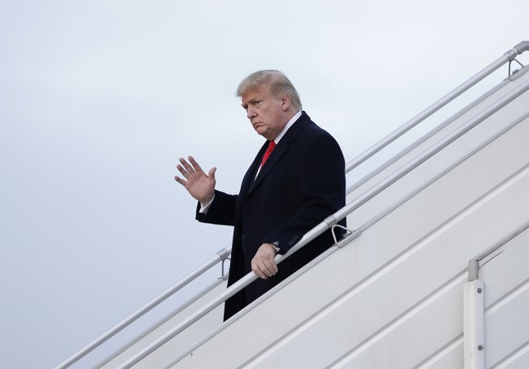 US President Donald Trump waves as he arrives at the airport in Zurich, Switzerland, Tuesday, Jan. 21, 2020. President Trump arrived in Switzerland on Tuesday to start a two-day visit to the World Eco ...