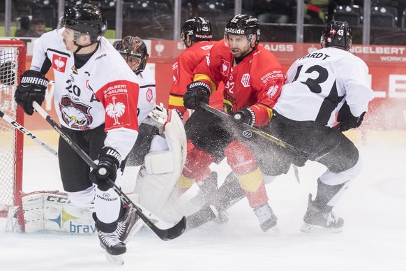 Malmoe&#039;s Henrik Hetta, goalkeeper Oscar Alsenfelt, Bern&#039;s Andrew Ebbett and Zach Boychuk, and Malmoe&#039;s Nichlas Hardt, from left, fight during the Champions Hockey League round of 16 sec ...