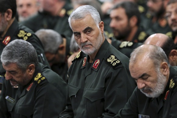 FILE - In this Sept. 18, 2016 file photo released by an official website of the office of the Iranian supreme leader, Revolutionary Guard Gen. Qassem Soleimani, center, attends a meeting with Supreme  ...