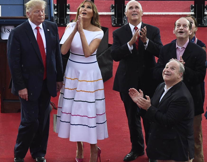 President Donald Trump, standing with first lady Melania Trump, Vice President Mike Pence, and acting Defense Secretary Mark Esper, and others, watch as the US Navy Blue Angels flyover during an Indep ...