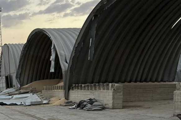 In this photo provided by the Odesa Regional Administration Press Office, a granary destroyed in a Russian drone attack at night is seen in a Danube port near Odesa, Ukraine, early hours Wednesday, Au ...