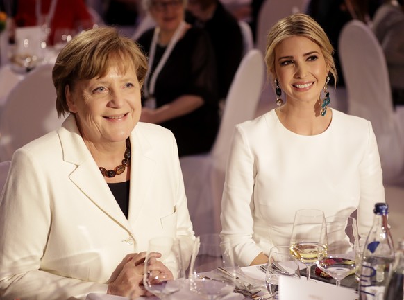 Ivanka Trump, daughter and adviser of U.S. President Donald Trump, left, sits next to German Chacellor Angela Merkel during a dinner after she participated in the W20 Summit in Berlin Tuesday, April 2 ...