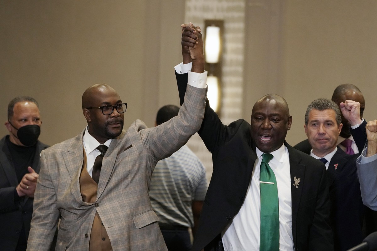 Philonise Floyd, left, and attorney Ben Crump react during a news conference after the guilty verdict was read in the trial of former Minneapolis police Officer Derek Chauvin, Tuesday, April 20, 2021, ...