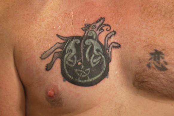 In this photo provided by WGME, Graham Platner, a democratic candidate for U.S. Senate, shows a cover-up tattoo that had previously been an image recognized as a Nazi symbol, during an interview on We ...
