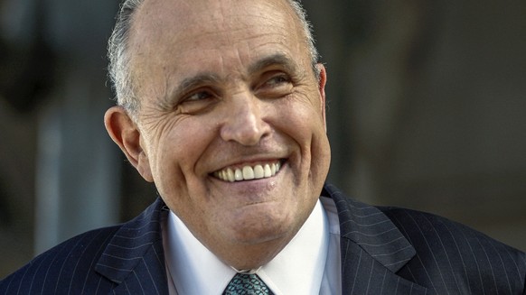 In this Oct. 16, 2014 file photo, attorney and former New York City Mayor Rudolph Giuliani speaks at a news conference outside Los Angeles Superior Court in Los Angeles. Giuliani is joining internatio ...