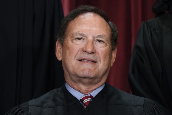 FILE - Associate Justice Samuel Alito joins other members of the Supreme Court as they pose for a new group portrait, at the Supreme Court building in Washington, Oct. 7, 2022. Supreme Court justices  ...
