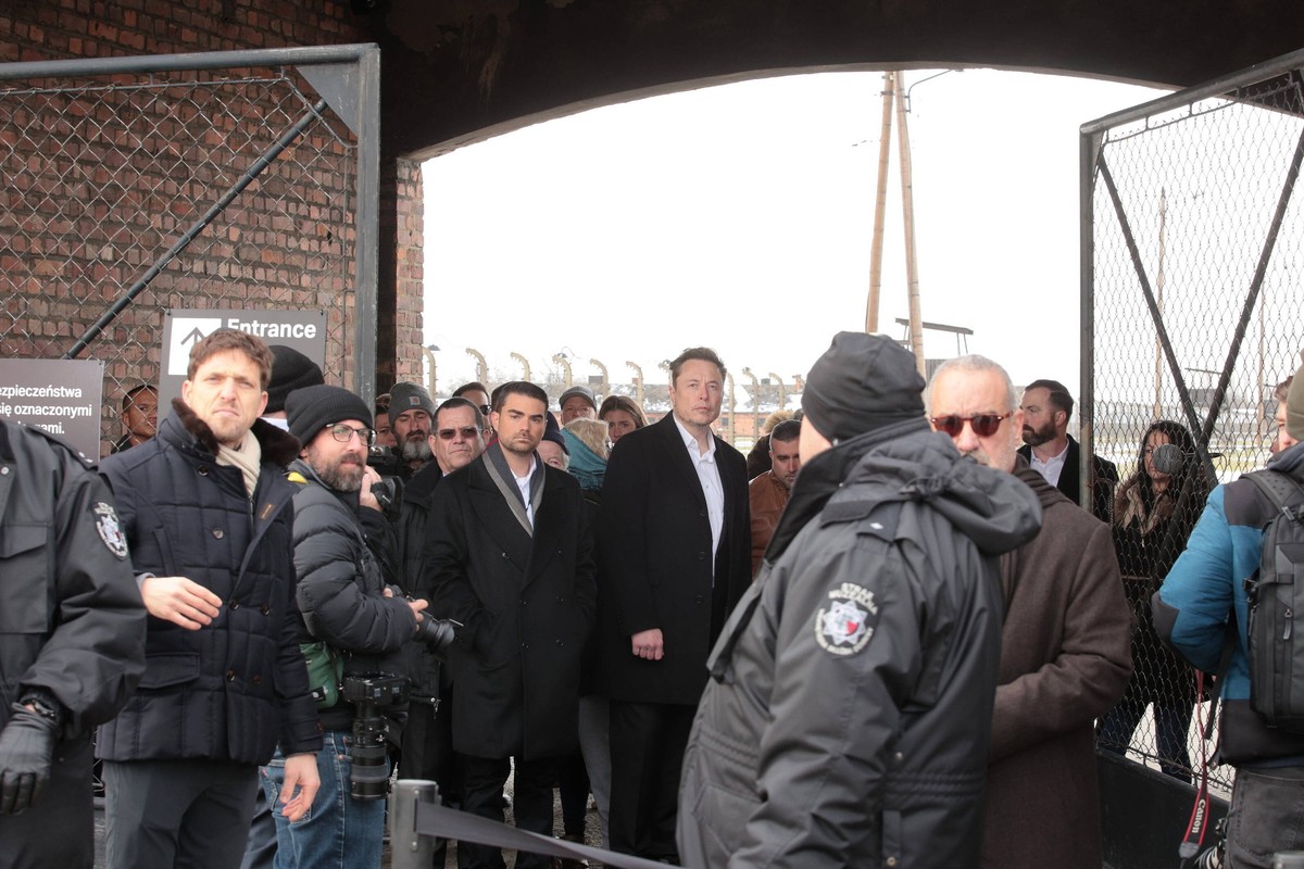 epa11096076 Tesla and Platform X owner Elon Musk during a visit to the former German Nazi concentration camp Auschwitz II-Birkenau in Birkenau, Poland, 22 January 2024. Elon Musk is visiting Poland wh ...
