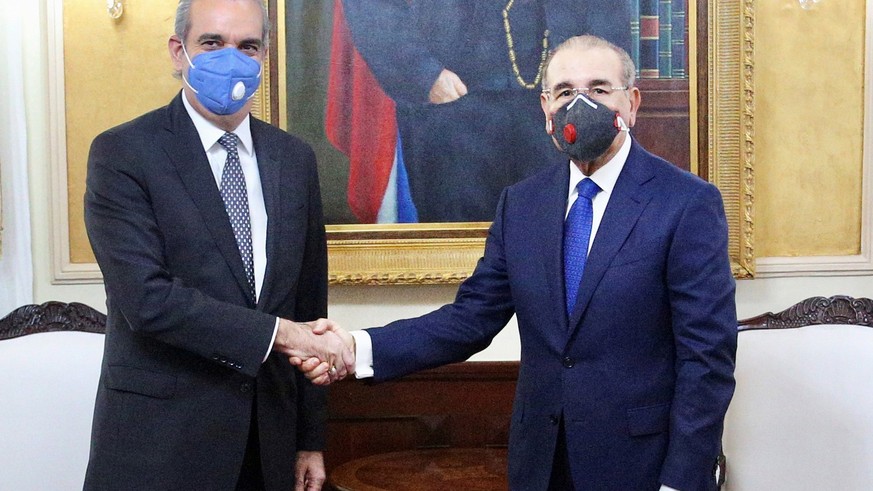 epa08534748 The President-elect of the Dominican Republic Luis Abinader (L) greets current President Danilo Medina during a meeting at the National Palace, in Santo Domingo, Dominican Republic, 08 Jul ...