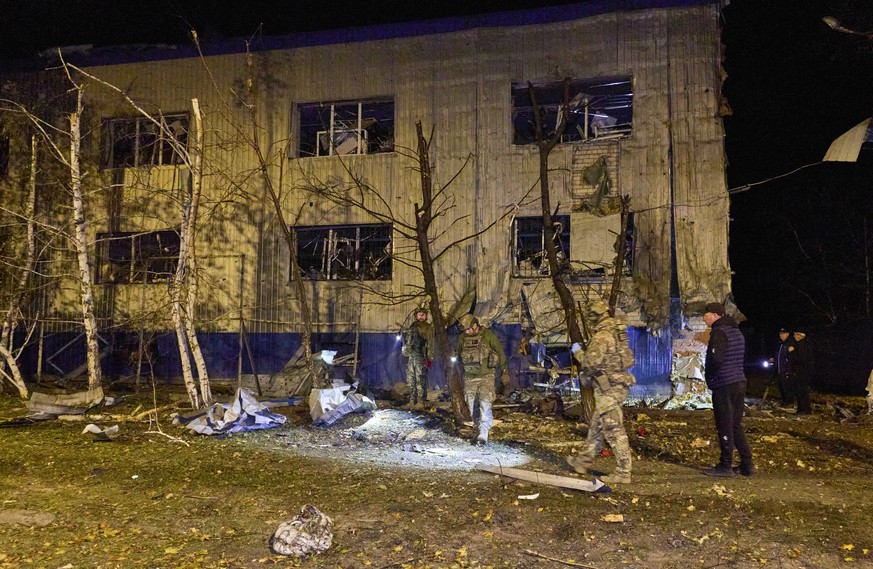 epa13282499 Ukrainian rescuers work at the site of a Russian attack on a residential area in Kharkiv, Ukraine, 05 October 2026, amid the ongoing Russian invasion. At least one person died, and six oth ...
