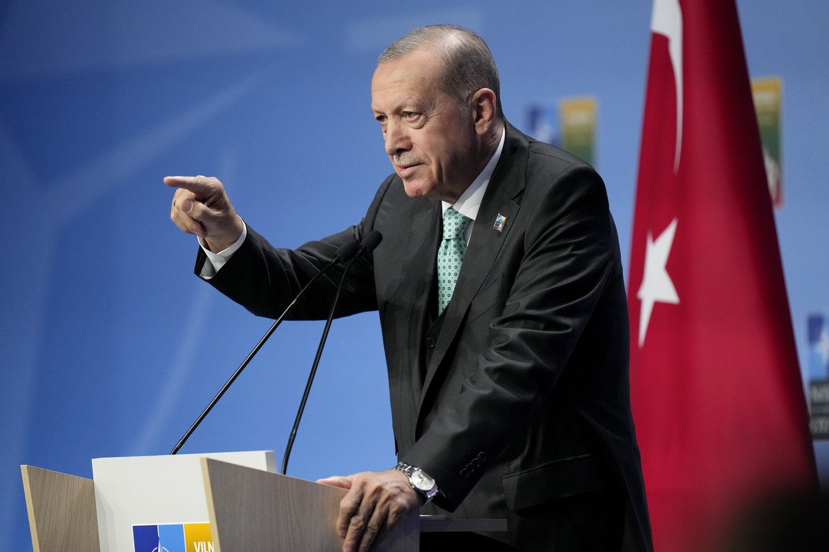Turkish President Recep Tayyip Erdogan, center, leaves after addressing a media conference at a NATO summit in Vilnius, Lithuania, Wednesday, July 12, 2023. NATO leaders gathered Wednesday to launch a ...