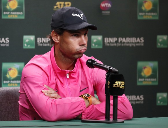 epa07443207 Rafael Nadal of Spain reacts to questions after announcing his withdrawal from his semifinal match against Roger Federer of Switzerland during the BNP Paribas Open tennis tournament at the ...