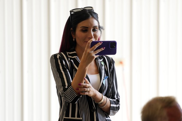 Laura Loomer watches as Republican presidential nominee former President Donald Trump visits the Shanksville Volunteer Fire Company in Shanksville, Pa., Wednesday, Sept. 11, 2024. (AP Photo/Matt Rourk ...
