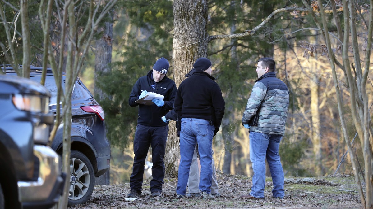 Law enforcement personnel investigate the scene of multiple shootings on Arkabutla Dam Road in Arkabutla, Miss on Friday, Feb. 17, 2023. Six people were fatally shot Friday at multiple locations in a  ...