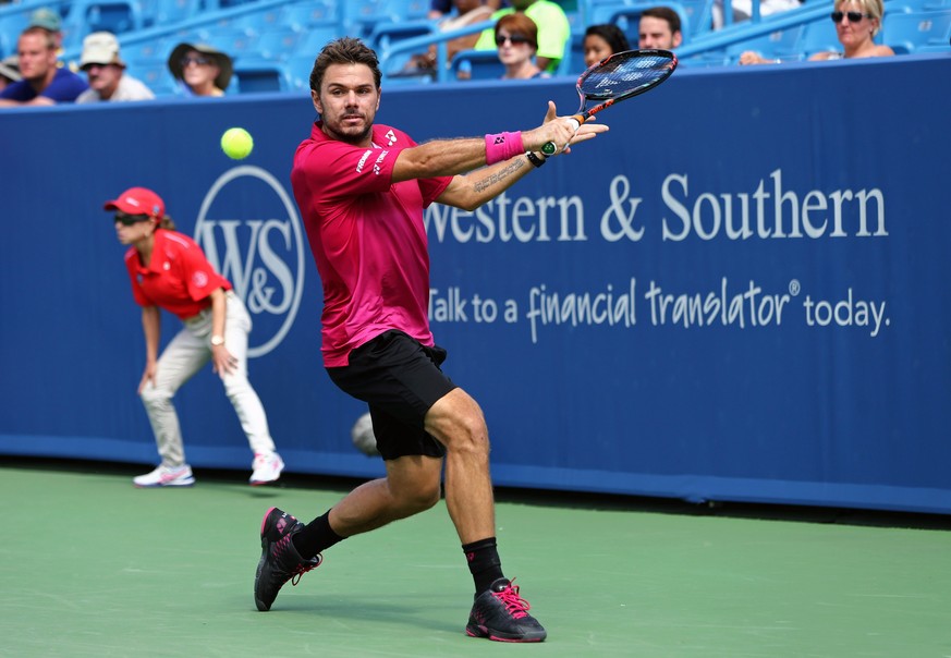 Aug 18, 2016; Mason, OH, USA; Stan Wawrinka (SUI) returns a shot against Grigor Dimitrov (BUL) on day six during the Western and Southern tennis tournament at Linder Family Tennis Center. Mandatory Cr ...